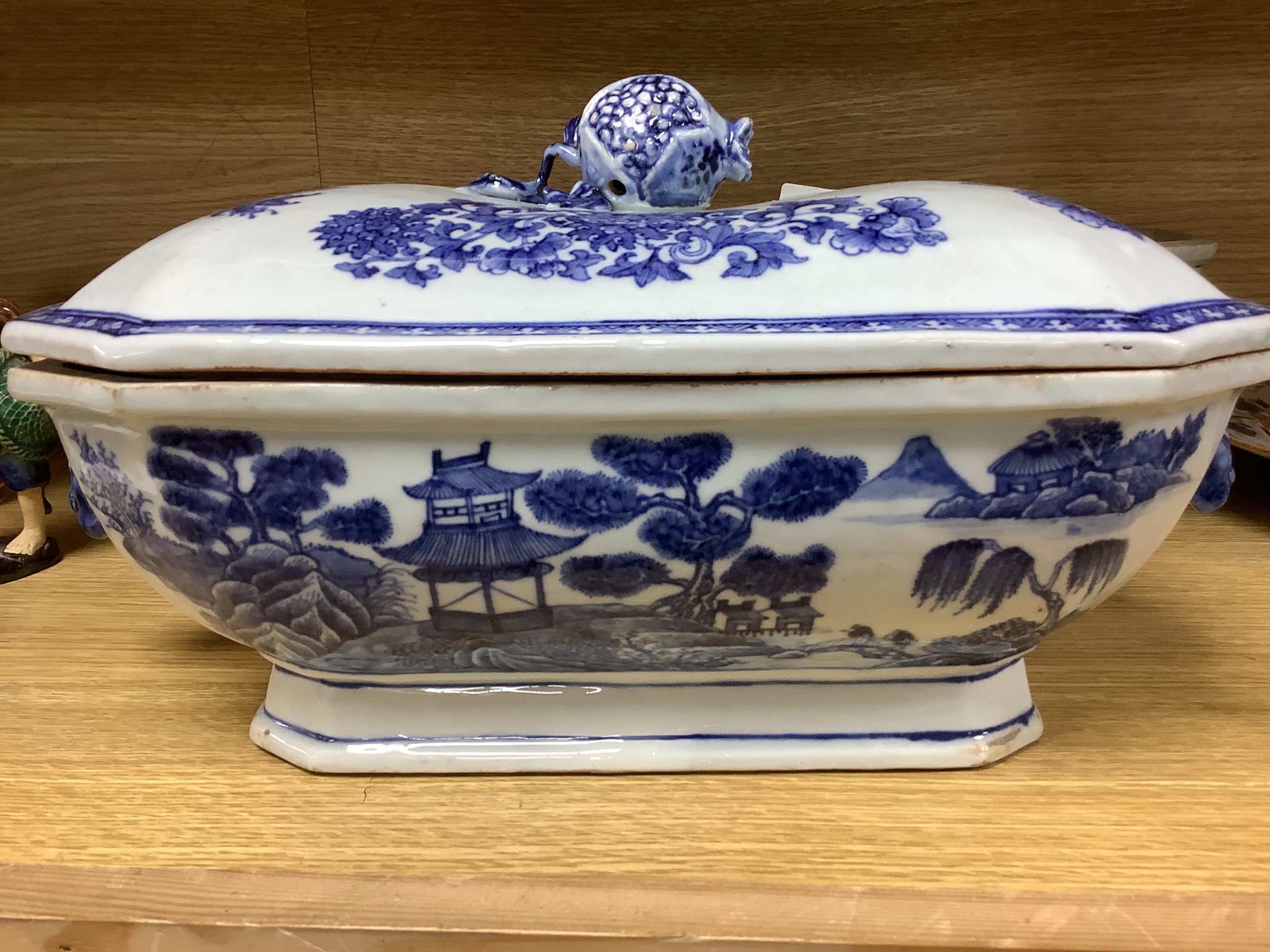 Two 18th century Chinese export blue and white lidded tureens, one lacking cover, 34cm